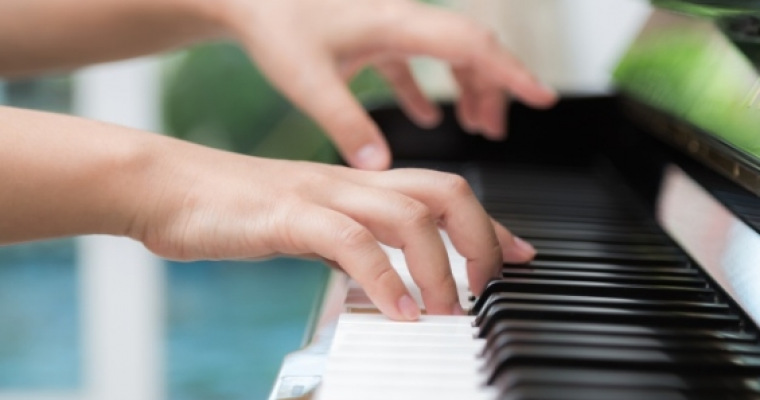 side view woman s hands playing piano 1232 356